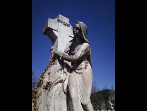 woman_with_a_cross_statue_.jpg